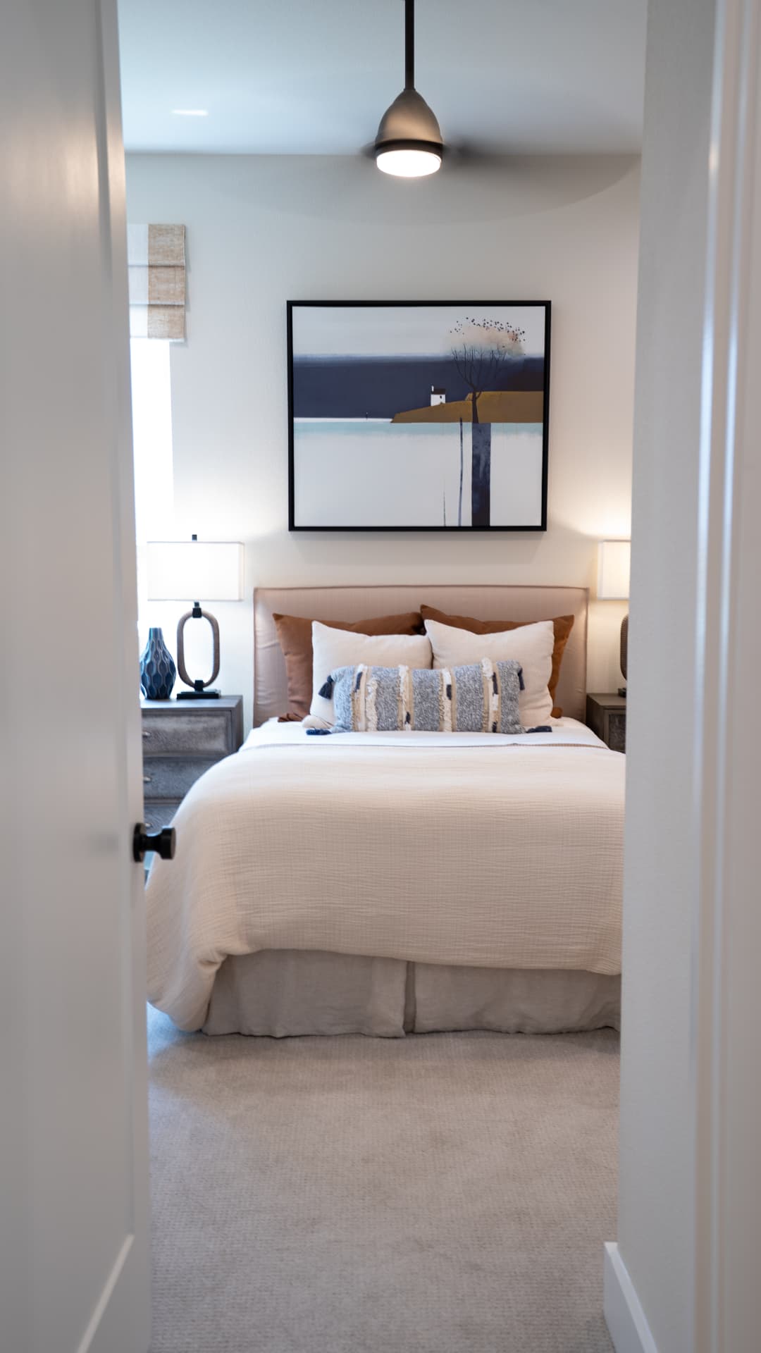Guest bedroom framed through an open doorway
